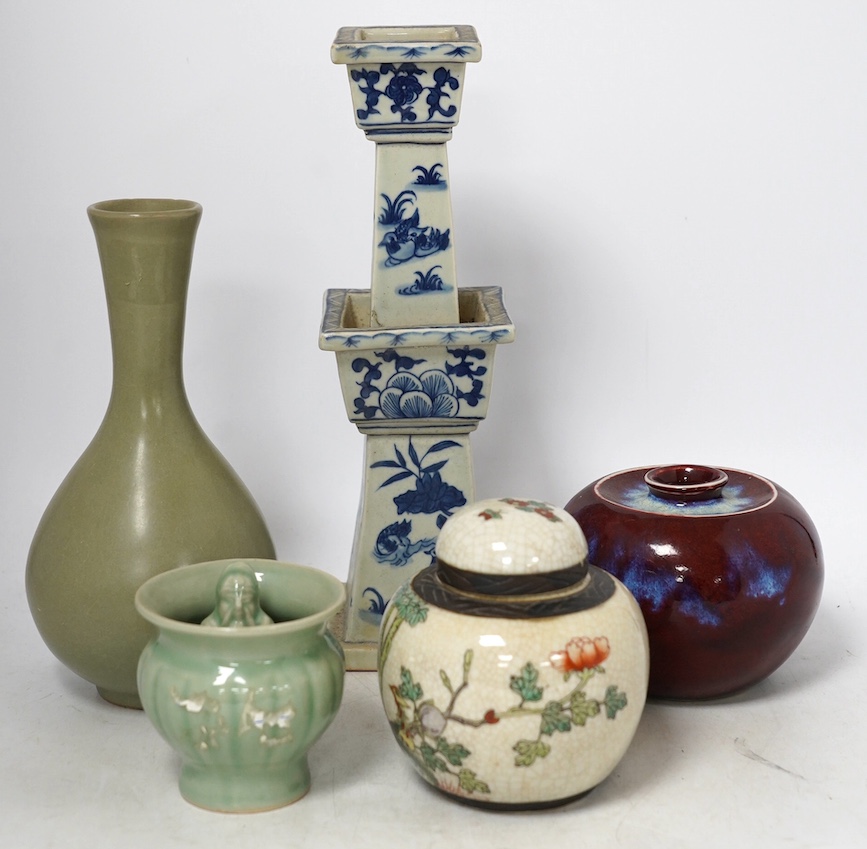 Chinese ceramics - a Celadon glazed vase, two jars and covers, a blue and white candlestick and a celadon pot, tallest 29cm (5). Condition - fair to good